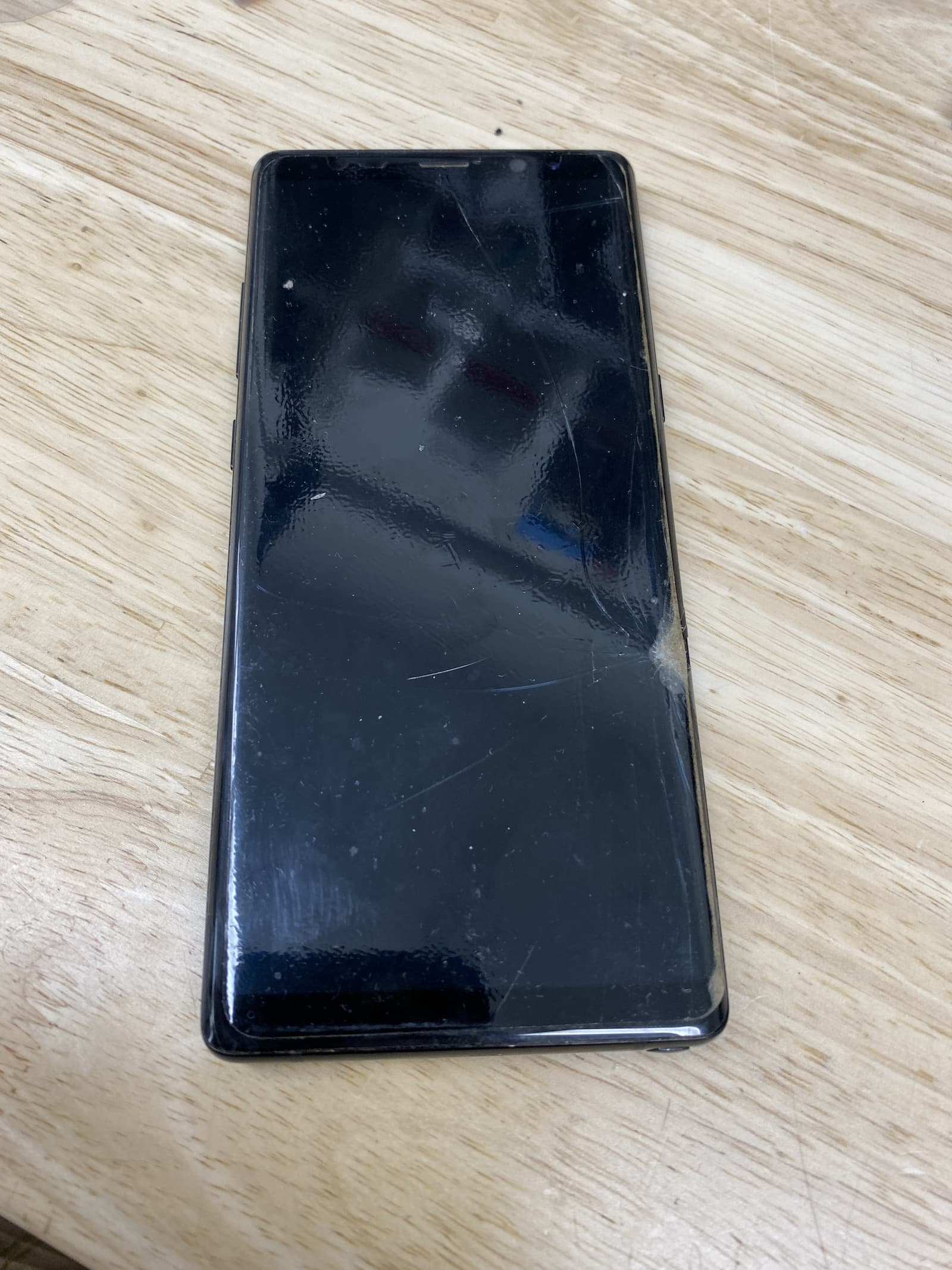 Cracked screen on Samsung Galaxy Note 8 with phone off.