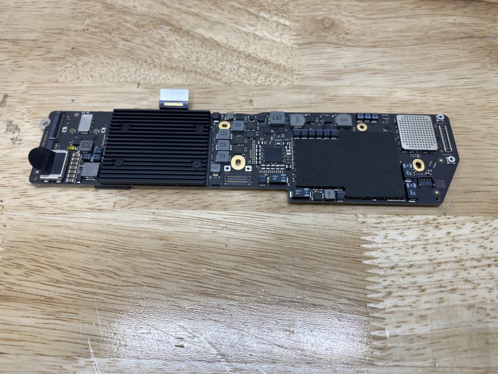 MacBook Air Logic Board removed from laptop.