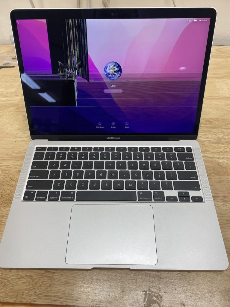 MacBook Pro with cracked screen.