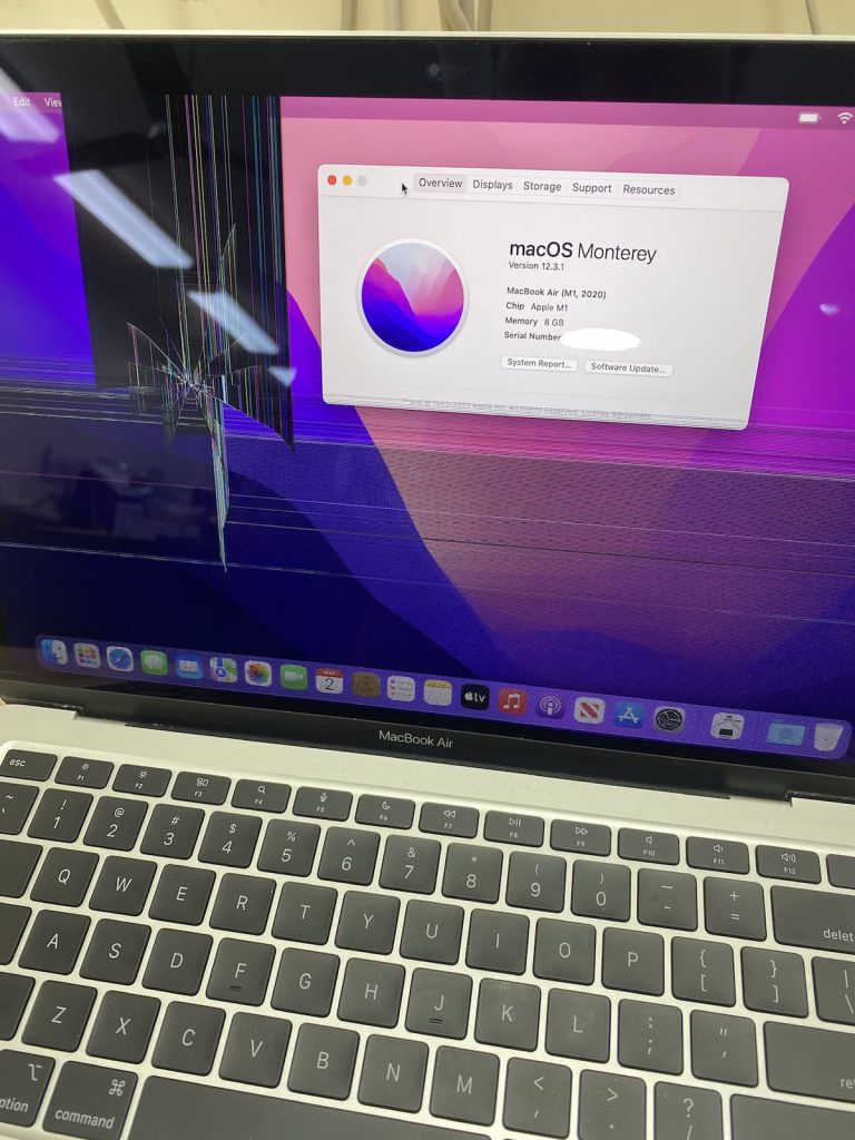 MacBook Air running Monterey with a cracked screen on the right-hand side.