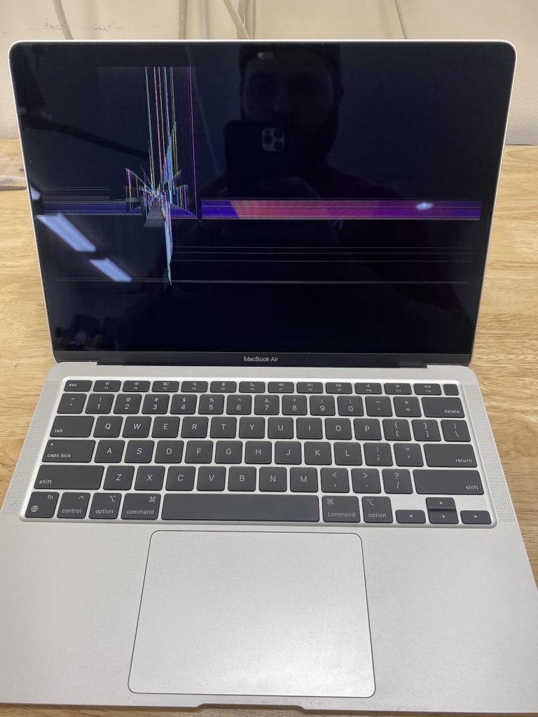 MacBook Air shutting down showing lines and wrong colors on screen.