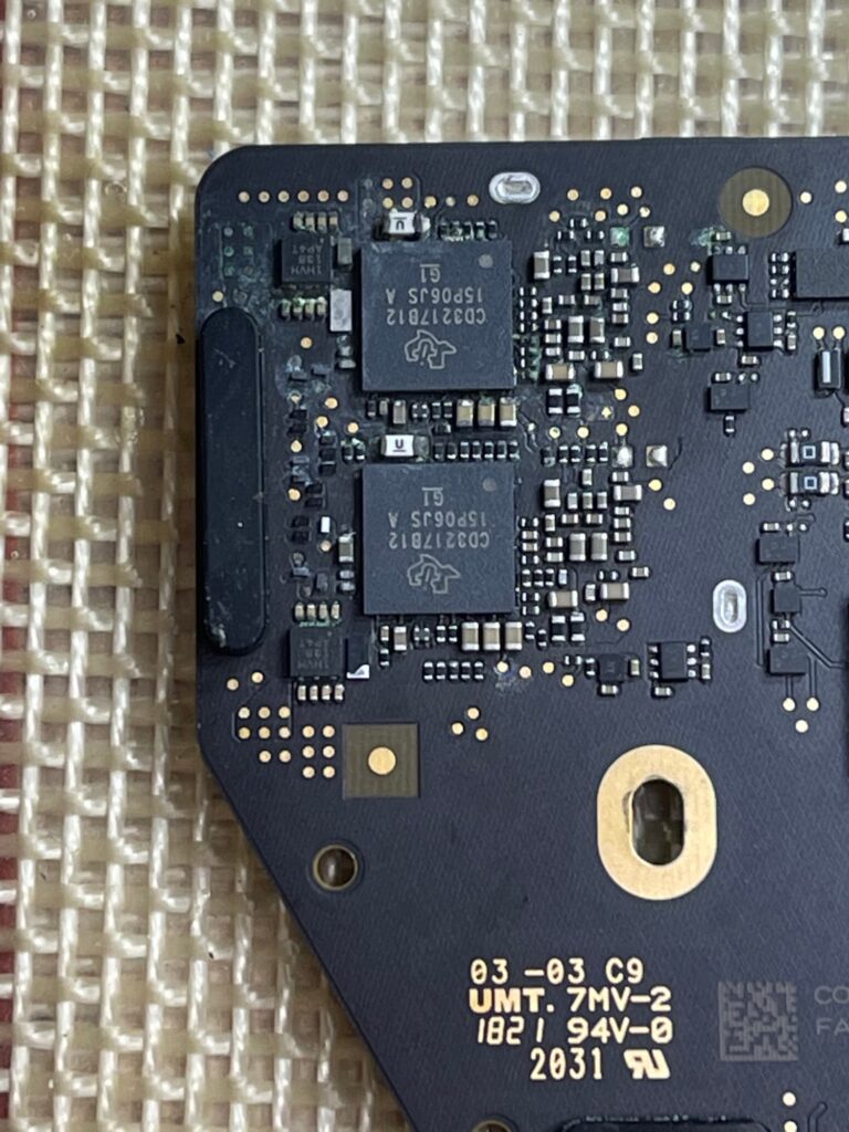 Liquid corrosion present on A2337 2020 M1 MacBook Air Logic board.