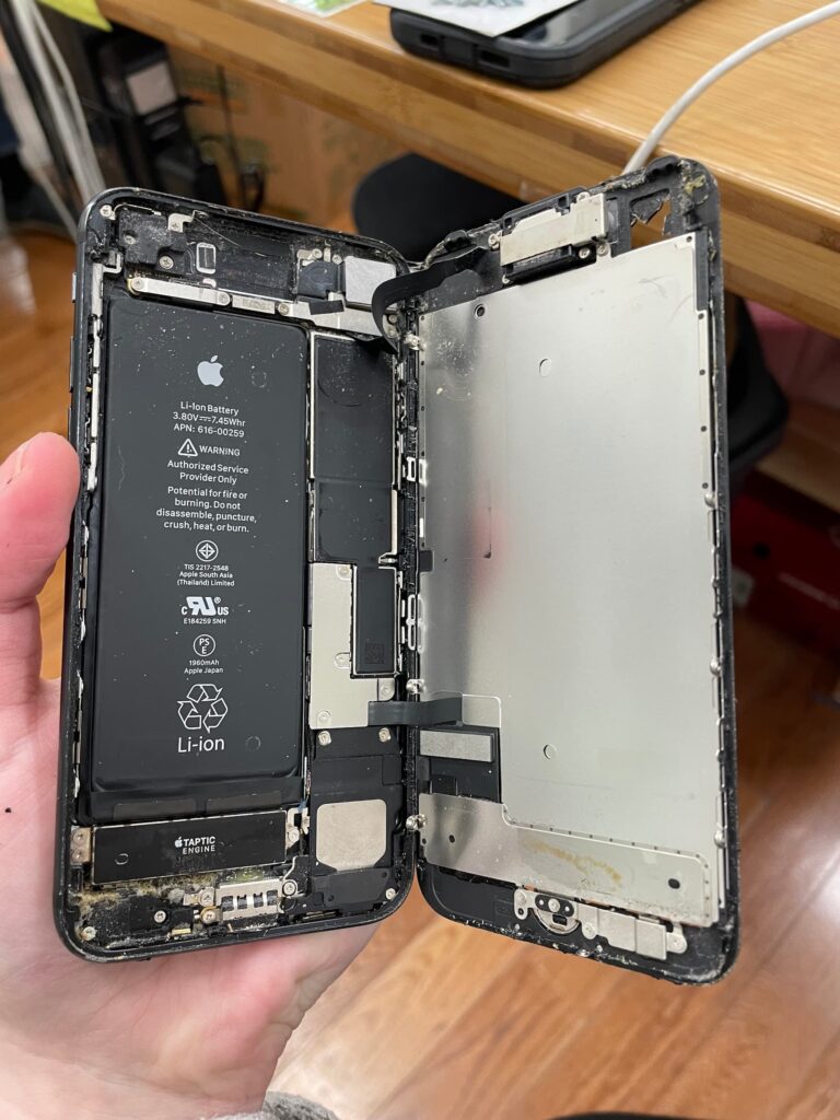 iPhone 7 opened with liquid damage present